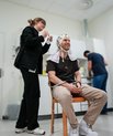 A photo of Emil Borup Rokkjær having EEG equipment placed on his head
